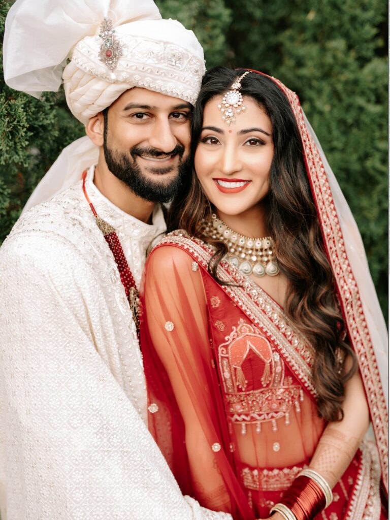 Priya & Dillan’s Gujarati Wedding | Indian Wedding Photographer Atlanta 13 Laughing close-up of a Gujarati bride in a red dupatta and groom in an ivory safa, by Indian wedding photographer Atlanta couples book, Noor K Photography