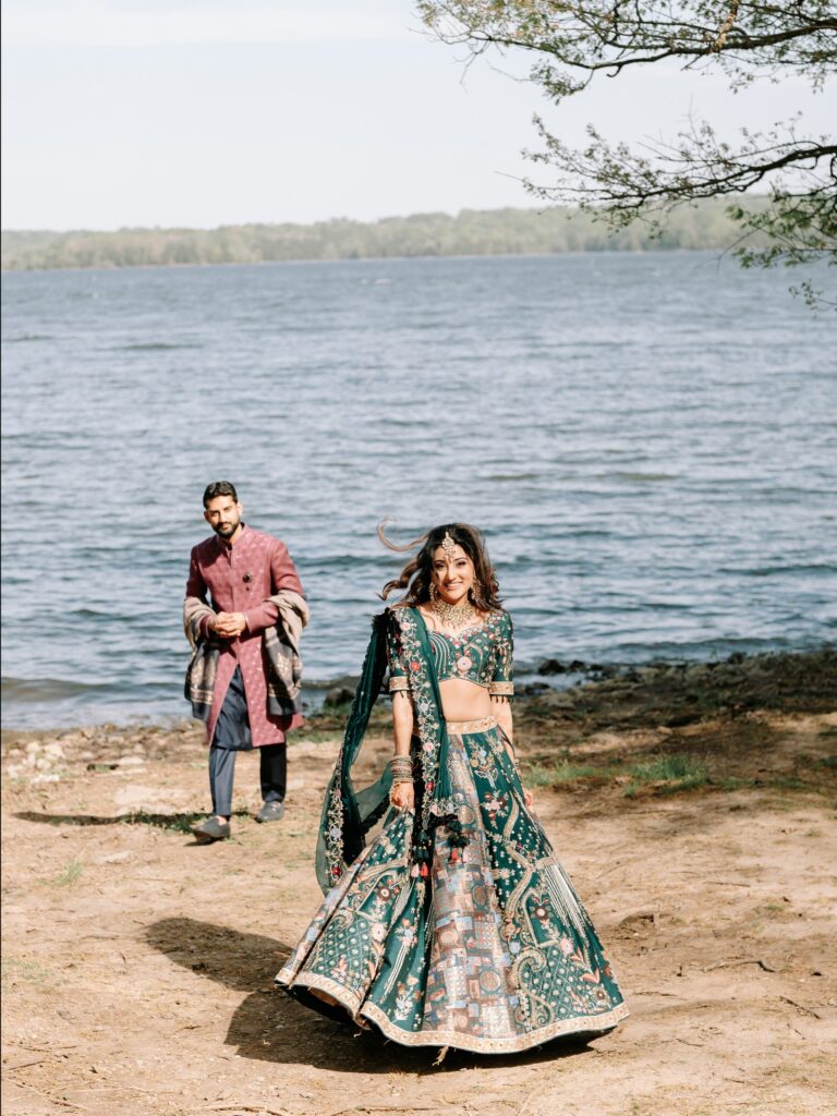 Priya & Dillan’s Gujarati Wedding | Indian Wedding Photographer Atlanta 7 Bride in a teal lehenga and groom in a plum sherwani walking by the lake in Atlanta, Georgia