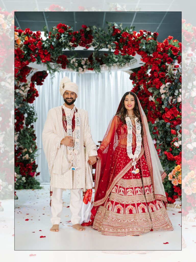 Priya & Dillan’s Gujarati Wedding | Indian Wedding Photographer Atlanta 20 Bride and groom standing under a red rose mandap after their Gujarati wedding ceremony