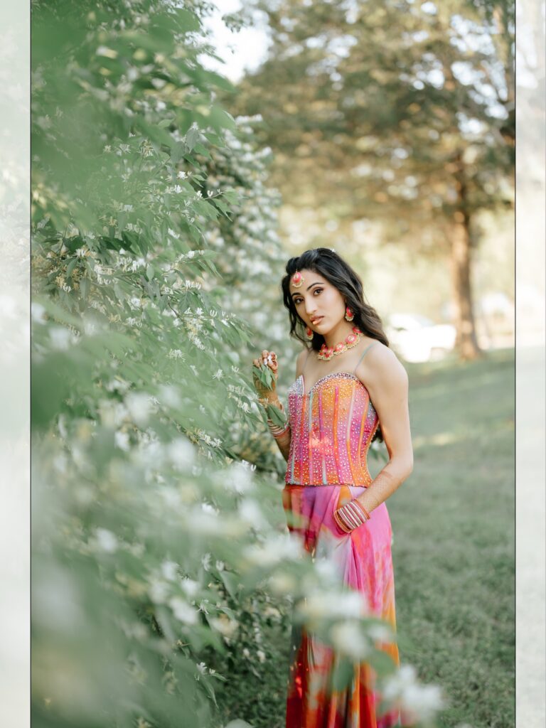 Priya & Dillan’s Gujarati Wedding | Indian Wedding Photographer Atlanta 4 Indian bride in a pink and orange lehenga among green trees in Atlanta, Georgia