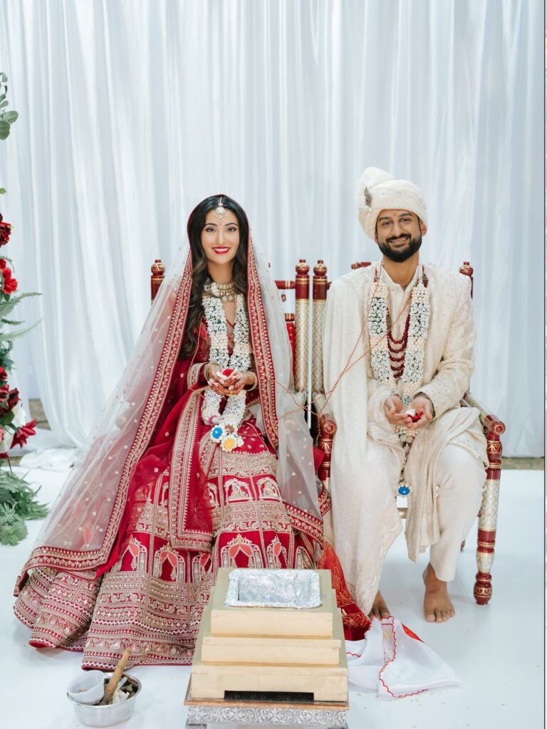 Priya & Dillan’s Gujarati Wedding | Indian Wedding Photographer Atlanta 19 Bride and groom seated in the mandap during their Gujarati Hindu wedding ceremony at GCA Hall
