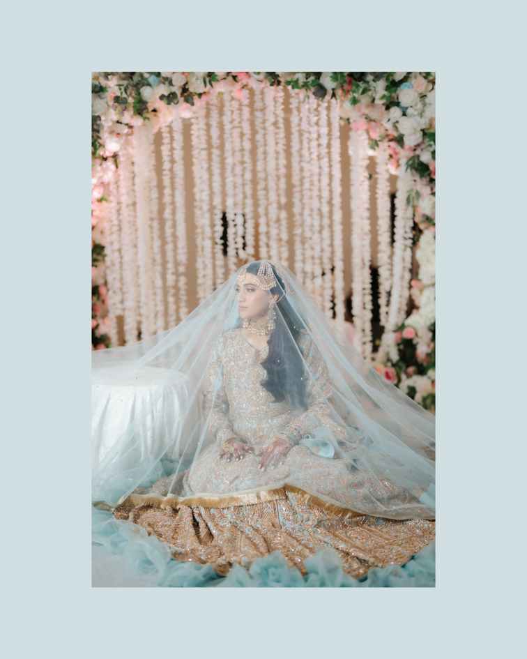 Hanna & Nabeel’s Stunning Nikkah at Hilton Tampa Downtown 6 Hanna seated under a sheer blue veil before the nikkah, Tampa Muslim wedding photography